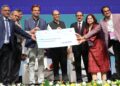 Mool's co-founders Seemant & Subhashree receiving check from MEITY Joint Secretary and other govt officials.